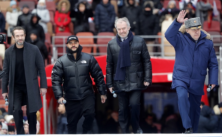 “We have preserved our great art. I’m proud of our country, I’m proud of our president, Vladimir Putin.” Valery Gergiev in his speech for Putin’s election campaign event in the Luzhniki stadium on March 3, 2018. Seen here with director Vladimir Mashkov, rapper Timati, and chairman of the State Duma Defense Committee, Vladimir Shamanov. • Photo © MICHAIL METZEL TASS